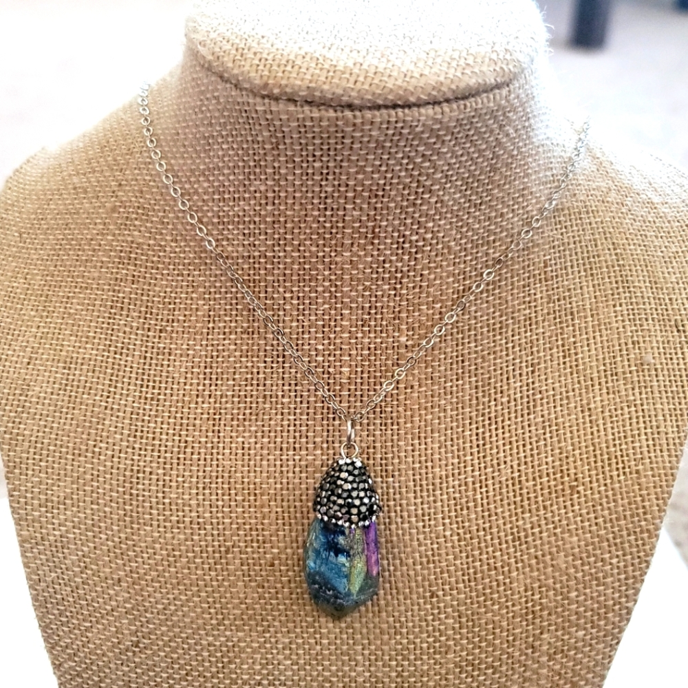 Iridescent Stone Pendant With Rhinestones on a silver tone necklace